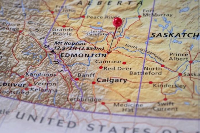 <strong>Canada and Alberta have sealed a wide-ranging deal that links deep emissions cuts with a long-term push to grow oil and gas output through new export pipelines and fast-track clean energy infrastructure.</strong>
Prime Minister Mark Carney and Alberta Premier Danielle Smith signed the memorandum of understanding in Calgary on Thursday (November 27). The MOU outlines a package led by Pathways Plus—described as the world’s largest carbon capture, utilization and storage project.
Under the pact, Canada also commits to suspend its Clean Electricity Regulations in Alberta and to refrain from implementing the long-discussed federal emissions cap for oil and gas.
In turn, Alberta agreed to advance a privately financed pipeline capable of transporting at least one million barrels per day of low-emissions bitumen to Asian markets, with Indigenous co-ownership built into the project’s structure.
The MOU states the application for the pipeline must be ready by July 1, 2026. In turn, the federal government will treat it as a project of national interest under the Building Canada Act.
Carney framed the deal as a response to global instability and a pivot toward a more self-reliant economic foundation.
“In the face of global trade shifts and profound uncertainty, Canada and Alberta are striking a new partnership to build a stronger, more sustainable, and more independent Albertan and Canadian economy,” he said in a statement. “We will make Canada an energy superpower, drive down our emissions and diversify our export markets.”
Beyond oil, the arrangement includes extensive commitments to expand nuclear power, strengthen Alberta’s electricity grid, and support thousands of megawatts of new AI-oriented computing capacity, including sovereign cloud infrastructure for Canada and its allies.
Alberta will also pursue major transmission interties with British Columbia and Saskatchewan to move low-carbon electricity across provincial borders, a step both governments say is essential for decarbonizing energy-intensive industries.
The MOU also sets a course for a new industrial carbon pricing agreement, with Alberta’s TIER regime remaining the backbone of provincial regulation. Both governments agreed to a minimum effective credit price of US$130 per metric ton alongside a methane-reduction target of 75 percent by 2035.
“Canada is acting decisively to establish ourselves as a global energy superpower in the face of a changing world,” added Tim Hodgson, Canada’s Minister of Energy and Natural Resources.
“Together, Canada and Alberta will not only export critical energy to our customers, we will also support our allies, create hundreds of thousands of jobs here at home, and show that our energy sector can lead on a global stage.”
A joint implementation committee is slated to finalize these frameworks by April 1, 2026.
<strong>Securities Disclosure: I, Giann Liguid, hold no direct investment interest in any company mentioned in this article.</strong>
This post appeared first on investingnews.com